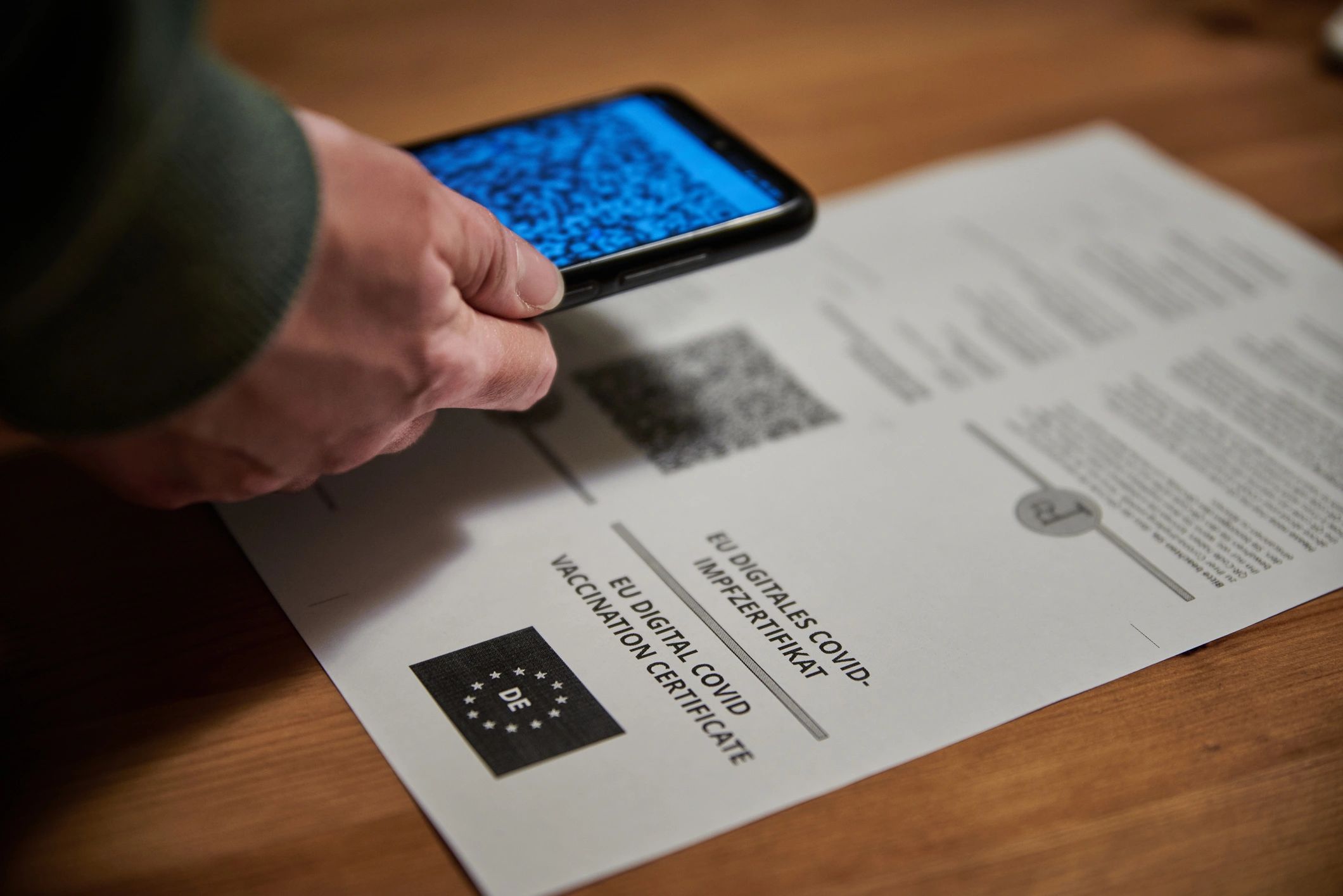 Person scanning a QR code on a phone for quick setup